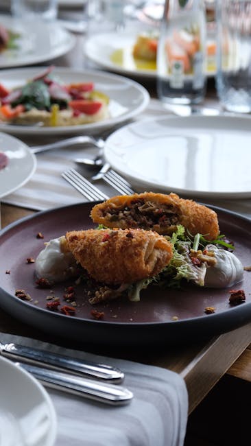 Crispy breaded chicken served on rustic plate with greens.